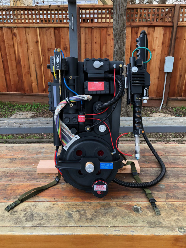 This proton pack was built with considerable care by Patrick Benton over the course of many years. He did extensive research to create an excellent replica of this famous prop. It includes a full electronics kit and sound system. He drilled hundreds of holes for a speaker grill in the back of the motherboard.